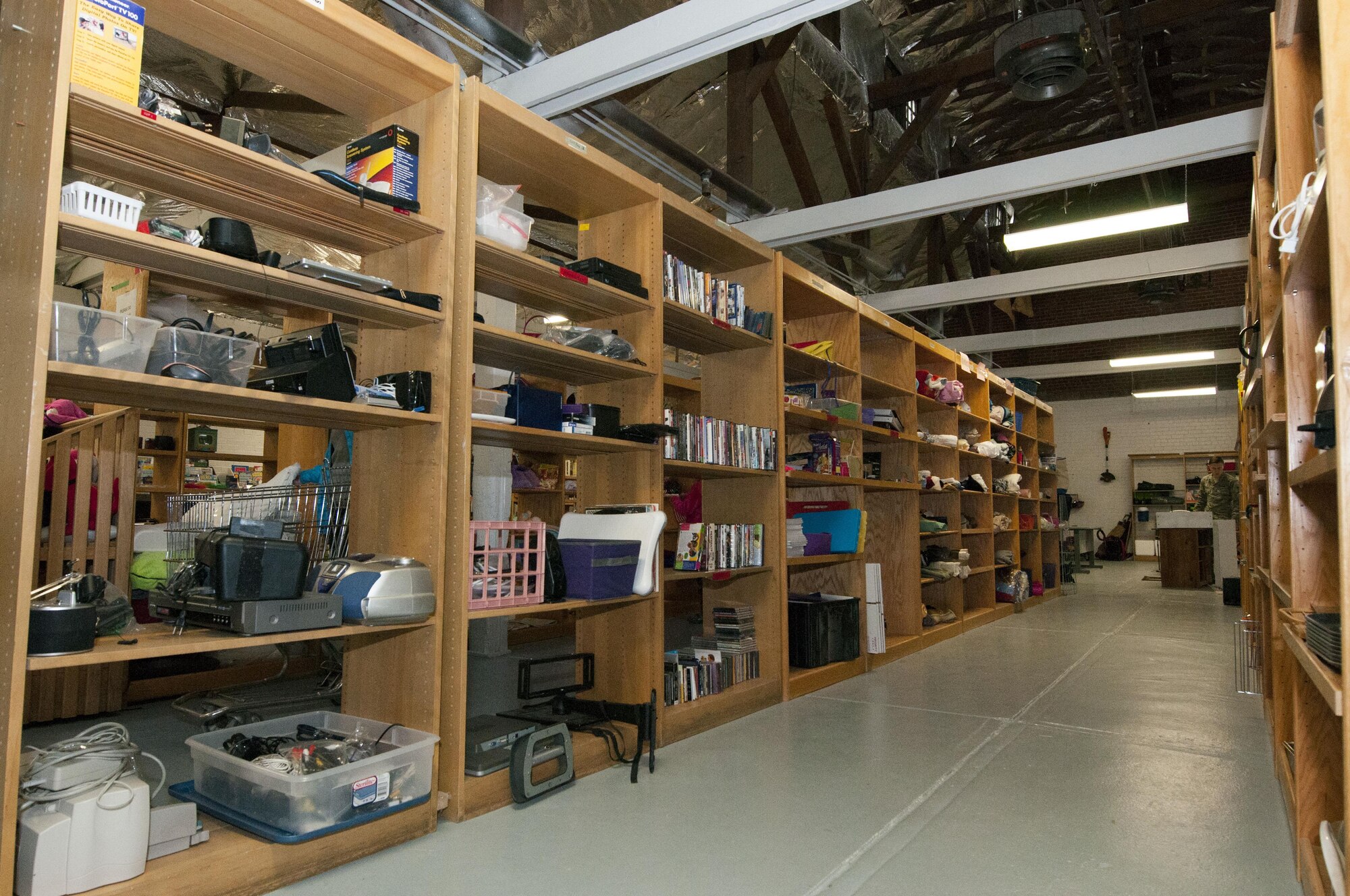 Items line the shelves at the Airman’s Attic on F.E. Warren Air Force Base, Wyo., April 26, 2017. Hundreds of items can be found at the Airman’s Attic such as books, movies, cooking equipment, electronics, children’s toys and furniture. The Airman’s Attic is a base resource where Airmen, dependents and retirees can shop for free through donated goods. (U.S. Air Force photo by Staff Sgt. Christopher Ruano)