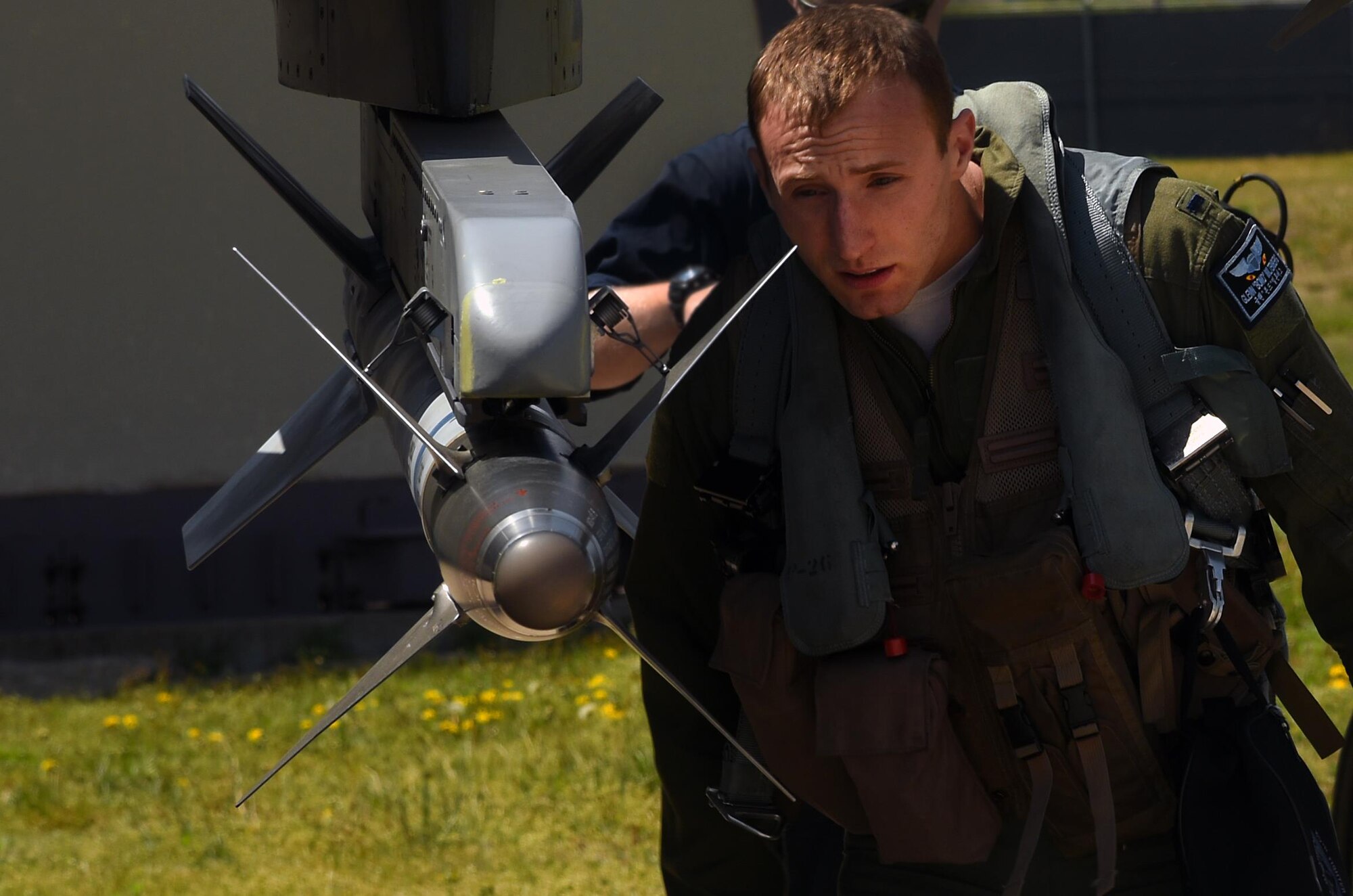 U.S. Air Force 1st Lt. Glenn Miltenberg, 35th Fighter Squadron pilot, conducts a pre-flight inspection on an F-16 Fighting Falcon during Exercise MAX THUNDER 17 at Kunsan Air Base, Republic of Korea, April 27, 2017. Max Thunder is part of a continuous exercise program to enhance interoperability between U.S. and ROK forces. These exercises highlight the longstanding military partnership, commitment and enduring friendship between two nations, which help to ensure security on the Korean Peninsula, and reaffirm the U.S. commitment to stability in the Northeast Asia region. (U.S. Air Force photo by Tech. Sgt. Jeff Andrejcik/Released)