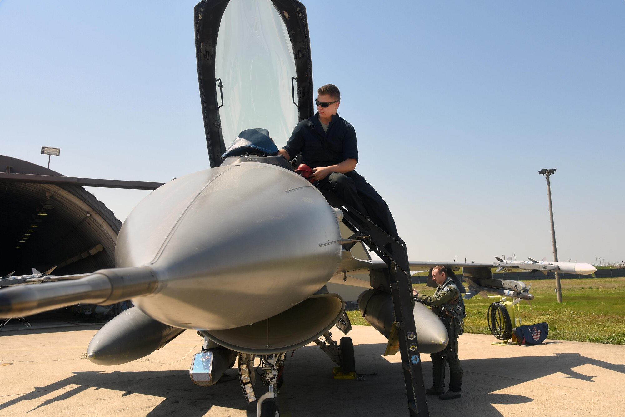 Airman 1st Class Austin Willey, 8th Aircraft Maintenance Squadron crew chief, left, and U.S. Air Force 1st Lt. Glenn Miltenberg, 35th Fighter Squadron pilot, conduct a pre-flight inspection on an F-16 Fighting Falcon during Exercise MAX THUNDER 17 at Kunsan Air Base, Republic of Korea, April 27, 2017. Max Thunder is a regularly scheduled training exercise designed to enhance the readiness of U.S. and ROK forces to defend the Republic of Korea. (U.S. Air Force photo by Tech. Sgt. Jeff Andrejcik/Released)