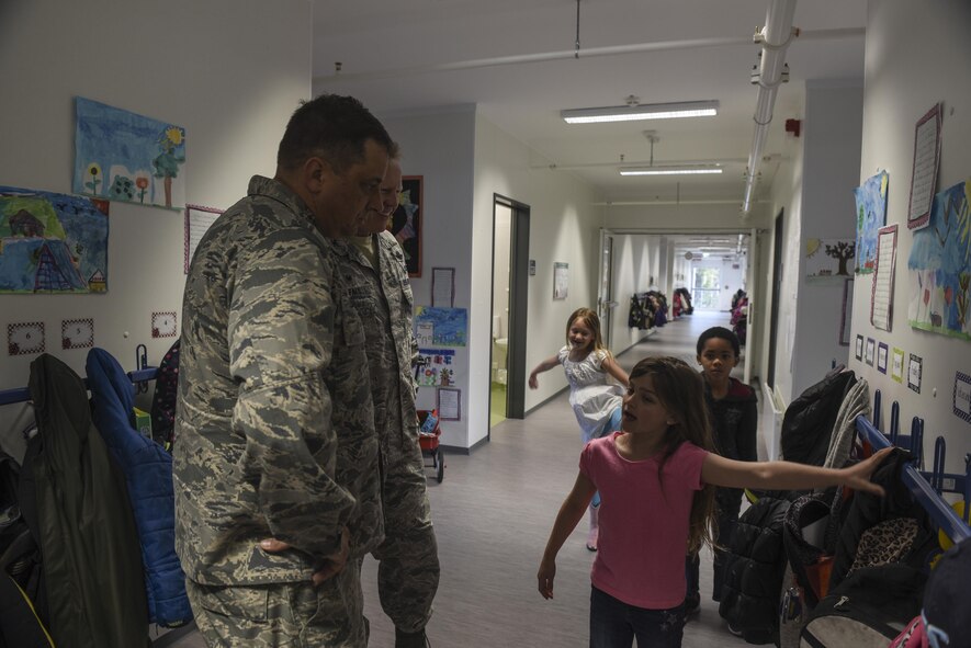 Spangdahlem Elementary School students give Col. Joe McFall, 52nd Fighter Wing commander and Col. Steven Zubowicz, 52nd Mission Support Group commander, a tour of the new modular building at Spangdahlem Air Base, Germany, April 26, 2017. The new two-story modular building includes up-to-date classrooms, bathrooms, a kitchen and all required utilities. (U.S. Air Force photo by Senior Airman Dawn M. Weber)