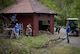 Volunteers from Ramstein Air Base and the town of Schwedelbach work together to repair a public barbecue pavilion in Schwedelbach, Germany, April 23, 2017. Airmen and local nationals teamed up through the 86th Airlift Wing Host Nations Office's Grassroots Program for Single Airmen to repair and beautify a public facility. The program aims to foster community and cross-cultural understanding between Airmen and the local community. (U.S. Air Force photo by Senior Airman Elizabeth Baker)