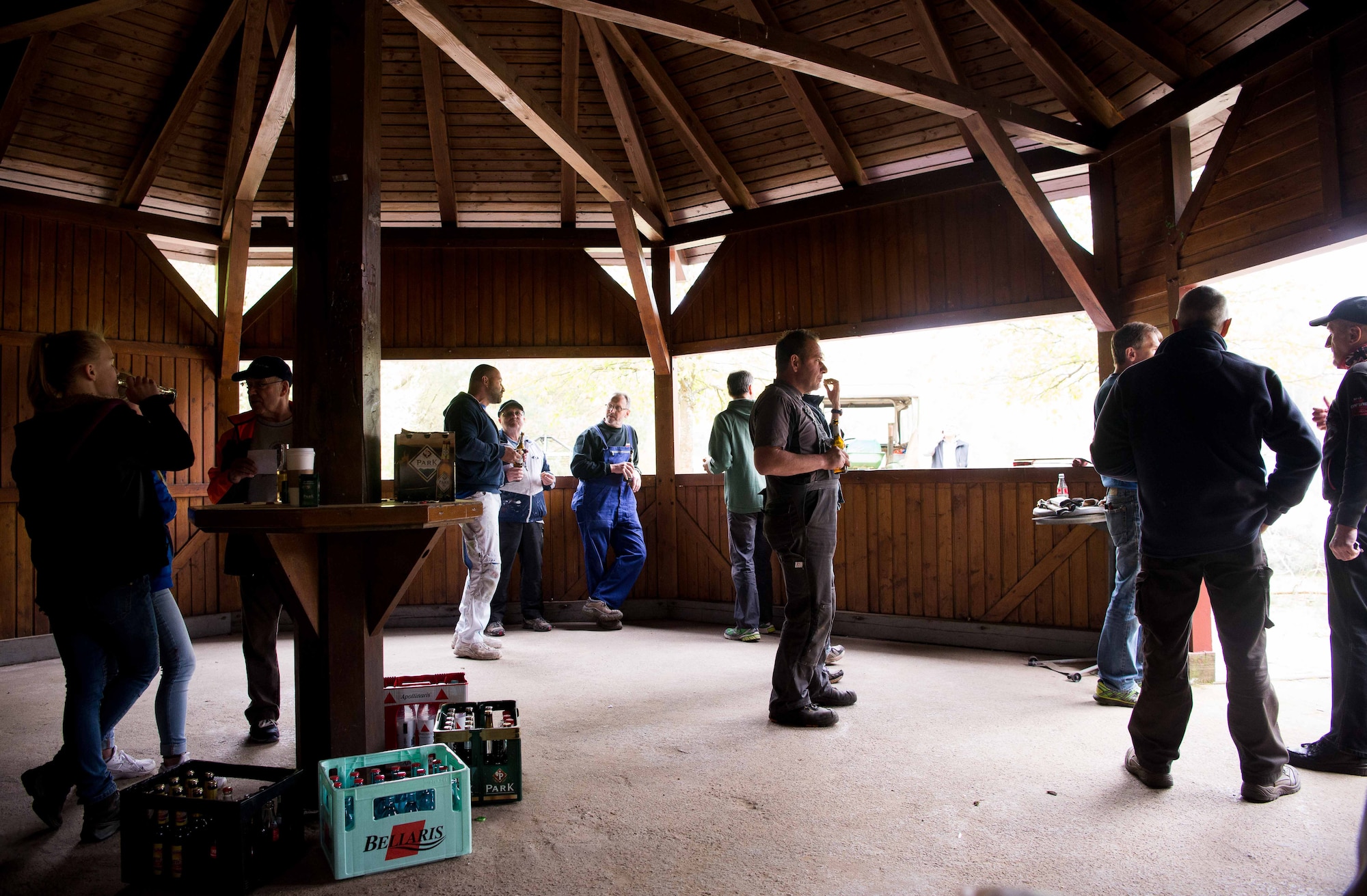 Local national volunteers from the town of Schwedelbach take a lunch break between repairing a public barbecue pavilion in Schwedelbach, Germany, April 23, 2017. The 86th Airlift Wing Host Nations Office's Grassroots Program for Single Airmen brought together volunteers from Ramstein Air Base and local nationals from Schwedelbach to improve the community and foster cross-cultural understanding. The program intends to host more activities designed to bring the base and local national community together. (U.S. Air Force photo by Senior Airman Elizabeth Baker)