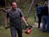 Henning Schaumloeffel, a local national volunteer from the town of Schwedelbach, prepares to clear trees from around a public barbecue pavilion in Schwedelbach, Germany, April 23, 2017. Ramstein Air Base Airmen and local nationals teamed up to paint the pavilion, repair the roof and clears trees and brush away from the immediate area so that others may enjoy the facility. (U.S. Air Force photo by Senior Airman Elizabeth Baker)