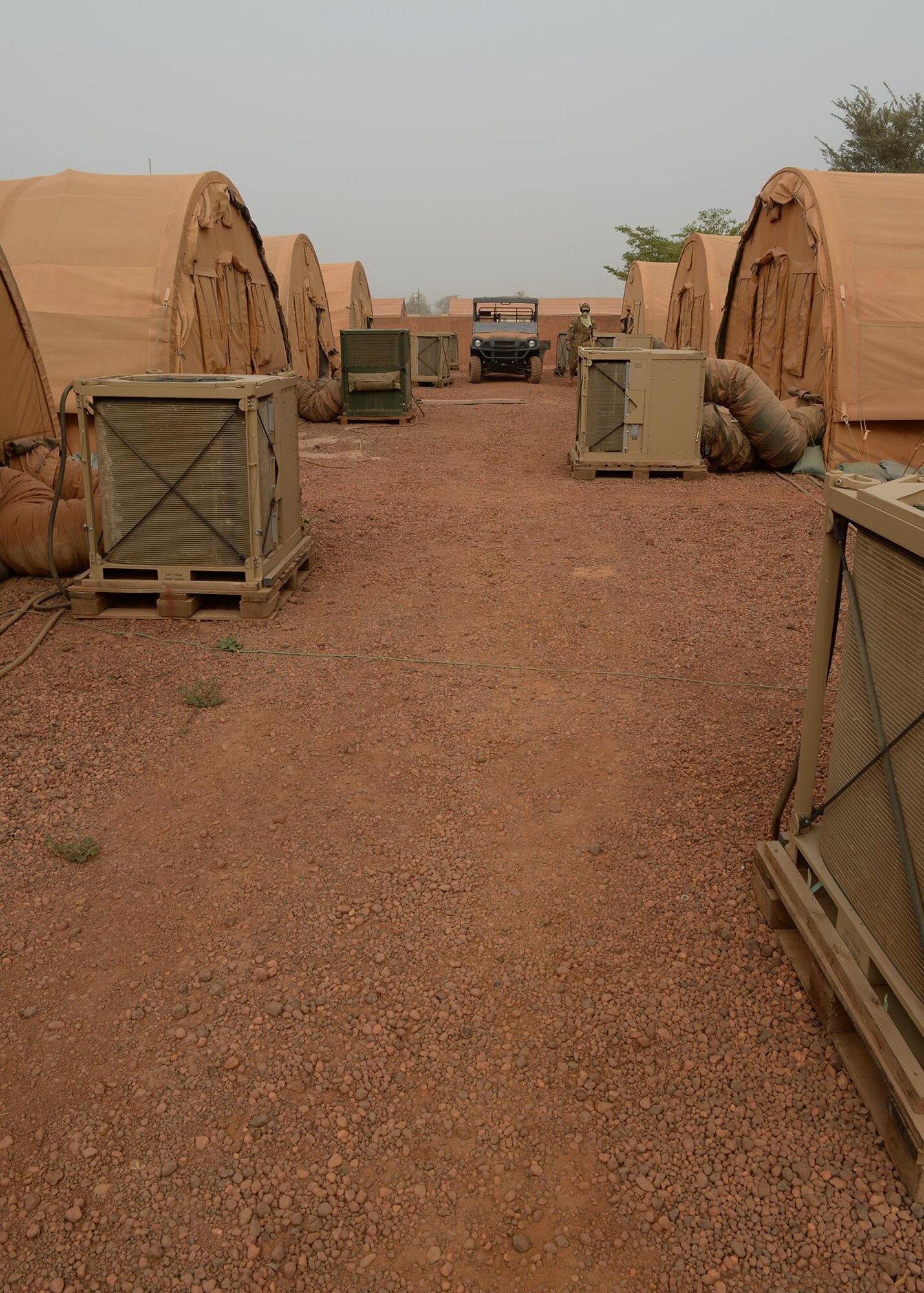 Heating Ventilation and Air Conditioning units operate behind tents at Nigerien Air Base 101, Niger, April 3, 2017. There are approximately 120 HVAC units that supply air conditioning to U.S. facilities on the base. (U.S. Air Force photo by Senior Airman Jimmie D. Pike)