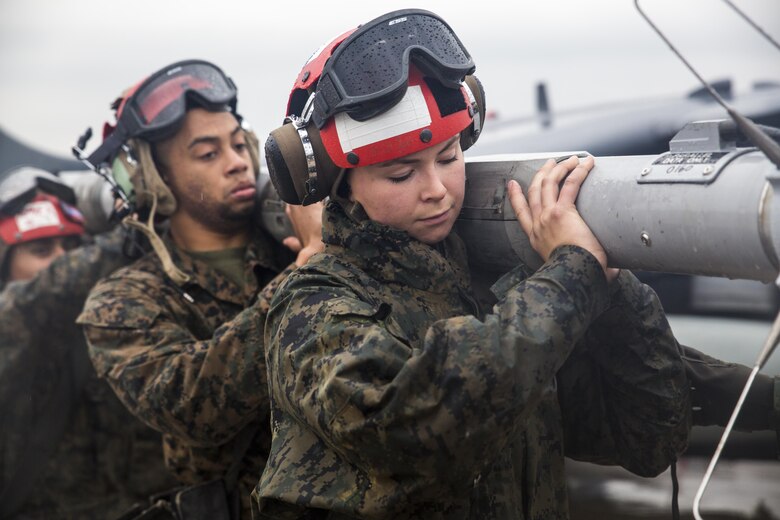 U.S. Marines with Marine Attack Squadron (VMA) 311 and Marine Air Group (MAG) 12 move a tactical combat training system pod to load onto an AV-8B Harrier during the first day of Exercise MAX THUNDER 17 at Kunsan Air Base, Republic of Korea, April 17, 2017. Max Thunder serves as an opportunity for U.S. and ROK forces to train together and sharpen tactical skills for the defense Asia-Pacific region. It is an annual military-flying exercise built to promote interoperability between U.S. and ROK forces. (U.S. Marine Corps photo by Lance Cpl. Carlos Jimenez)