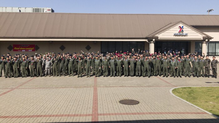 U.S. and Republic of Korea service members pose for a photo during the final brief of Exercise MAX THUNDER 17 at Kunsan Air Base, ROK, April 28, 2017. Max Thunder serves as an opportunity for U.S. and ROK forces to train together and sharpen tactical skills for the defense of the Asia-Pacific region. It is an annual military-flying exercise built to promote interoperability between U.S. and ROK forces. (U.S. Marine Corps photo by Lance Cpl. Carlos Jimenez)