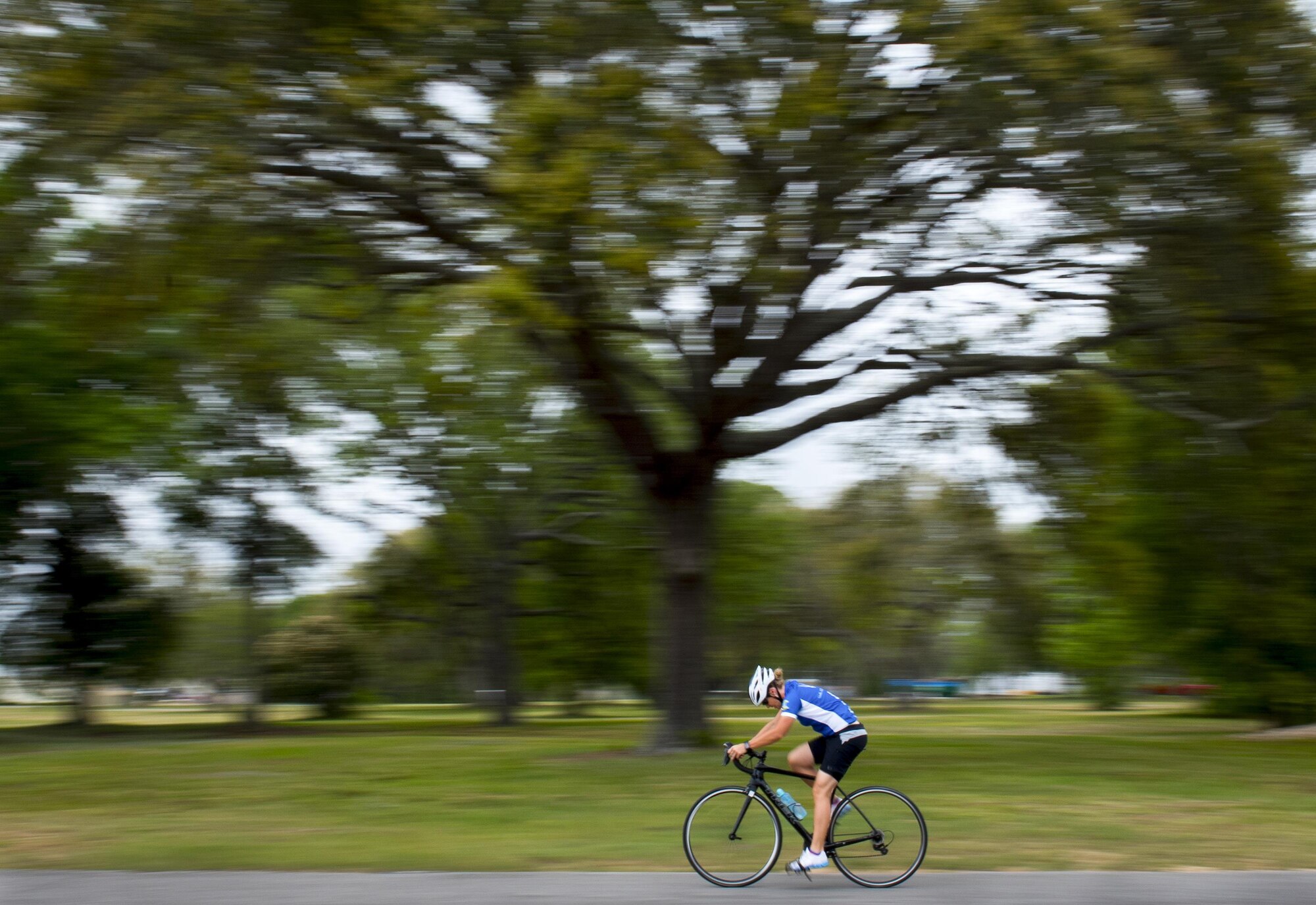 A Warrior Games athlete speeds by during a cycling session at the Air Force team’s training camp at Eglin Air Force Base, Fla., April 27. The base-hosted, week-long Warrior Games training camp is the last team practice session before the yearly competition in June. (U.S. Air Force photo/Samuel King Jr.)