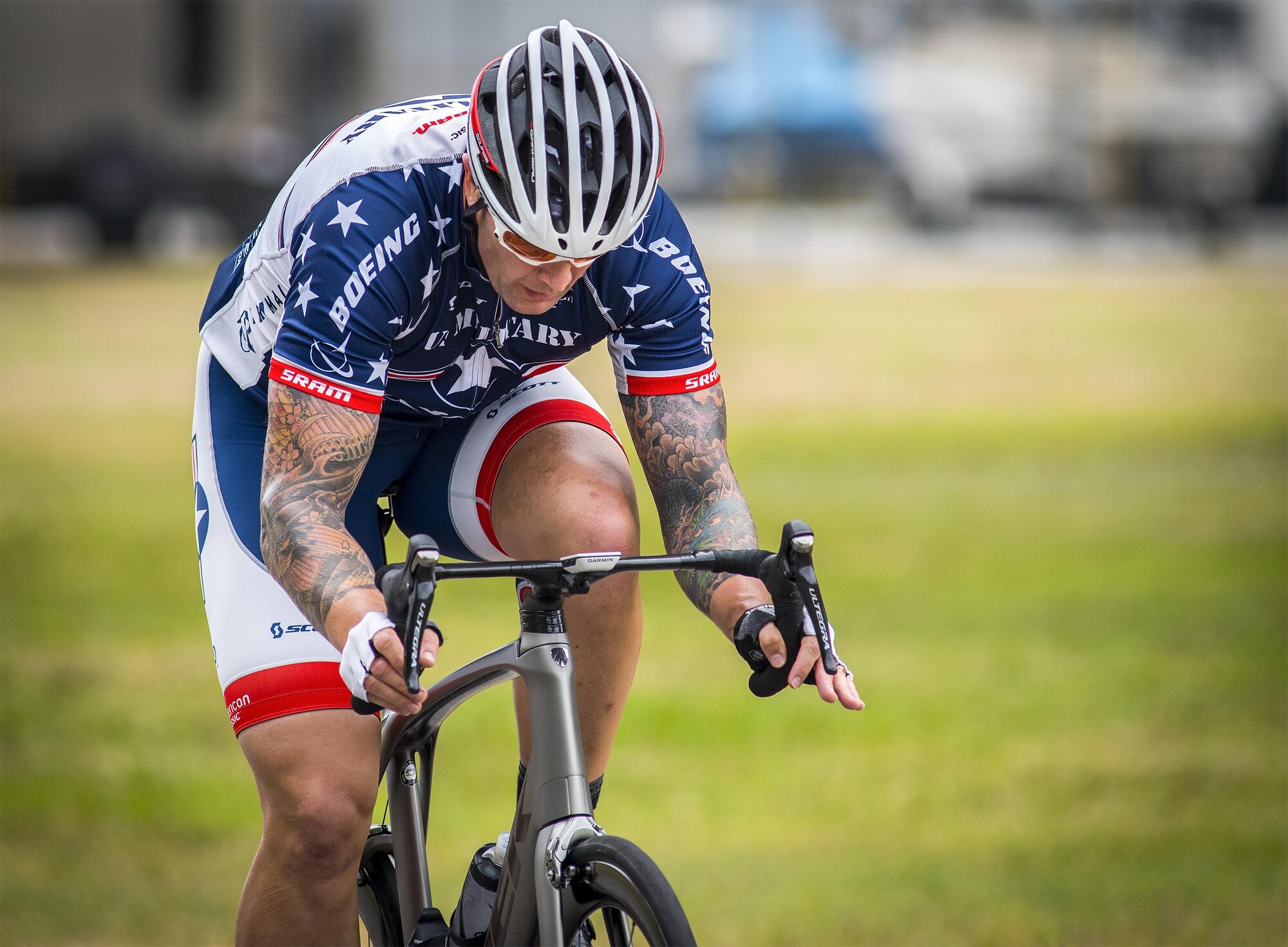 Rafael Morfin, a Warrior Games athlete, speeds by during a cycling session at the Air Force team’s training camp at Eglin Air Force Base, Fla., April 27. The base-hosted, week-long Warrior Games training camp is the last team practice session before the yearly competition in June. (U.S. Air Force photo/Samuel King Jr.)