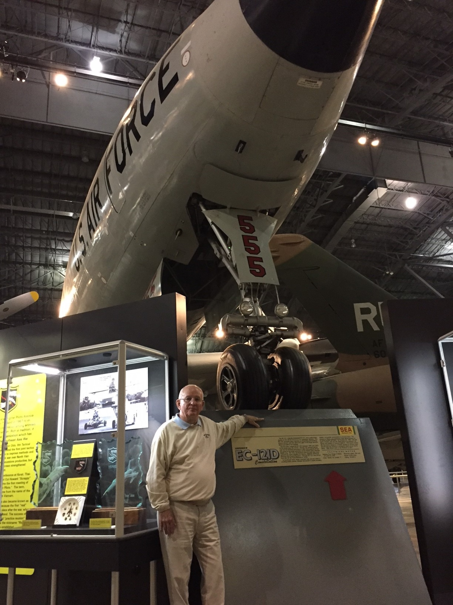 Robert Sargent, a retired master sergeant and radar crew chief once stationed at Wright-Patterson Air Force Base, stands beneath the Lockheed EC-121D Constellation ‘Triple Nickel’ he flew on that stands in the Southeast Asia War Gallery at the National Museum of the U.S. Air Force. (Skywrighter photo/Amy Rollins)
