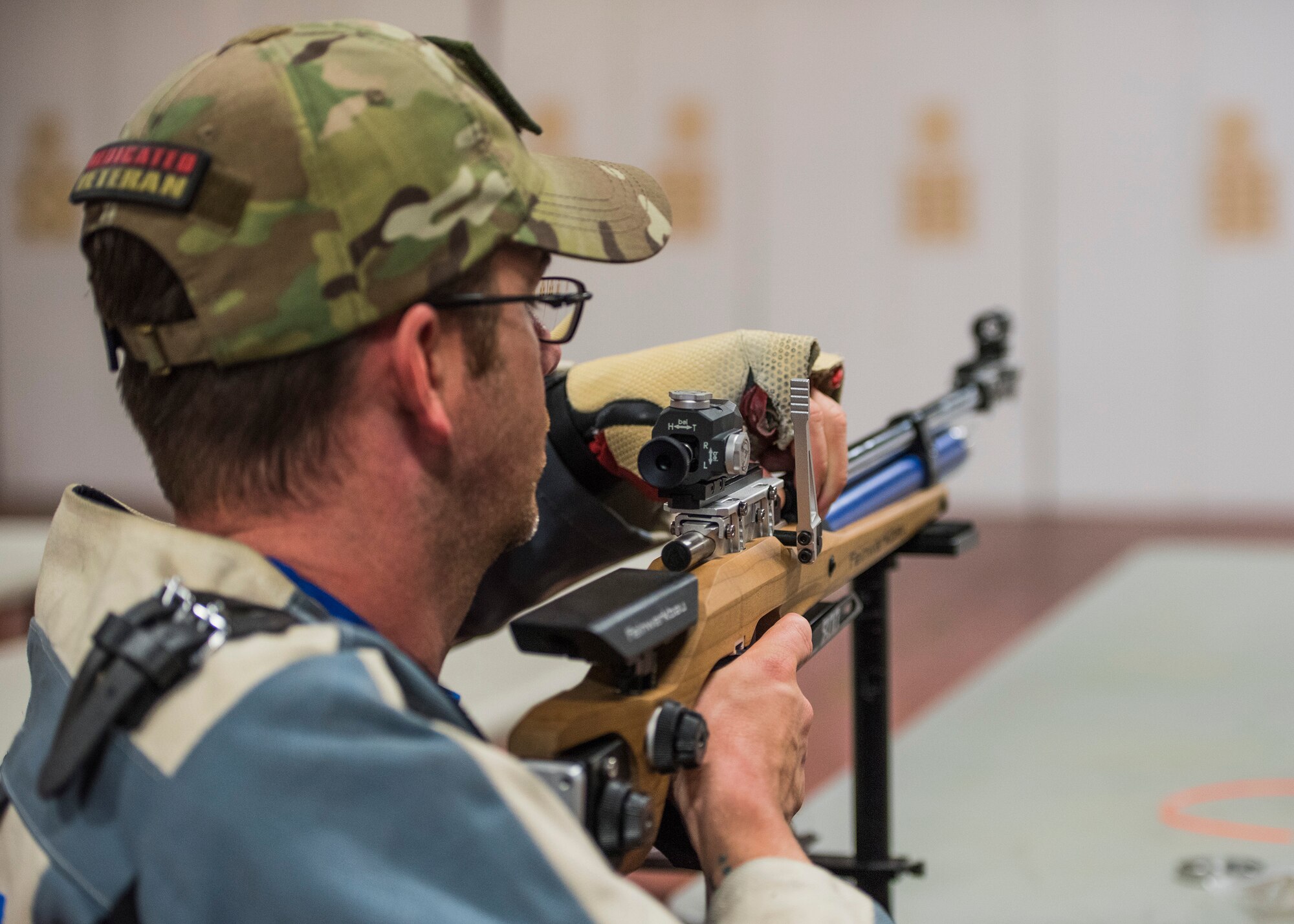 A Warrior CARE athlete, David Olson flips the pin on his air rifle during a shooting session at the adaptive sports camp at Eglin Air Force Base, Fla., April 26. The base hosts the week-long Wounded Warrior CARE event that helps recovering wounded, ill and injured military members through specific hand-on rehabilitative training. (U.S. Air Force photo/Ilka Cole)