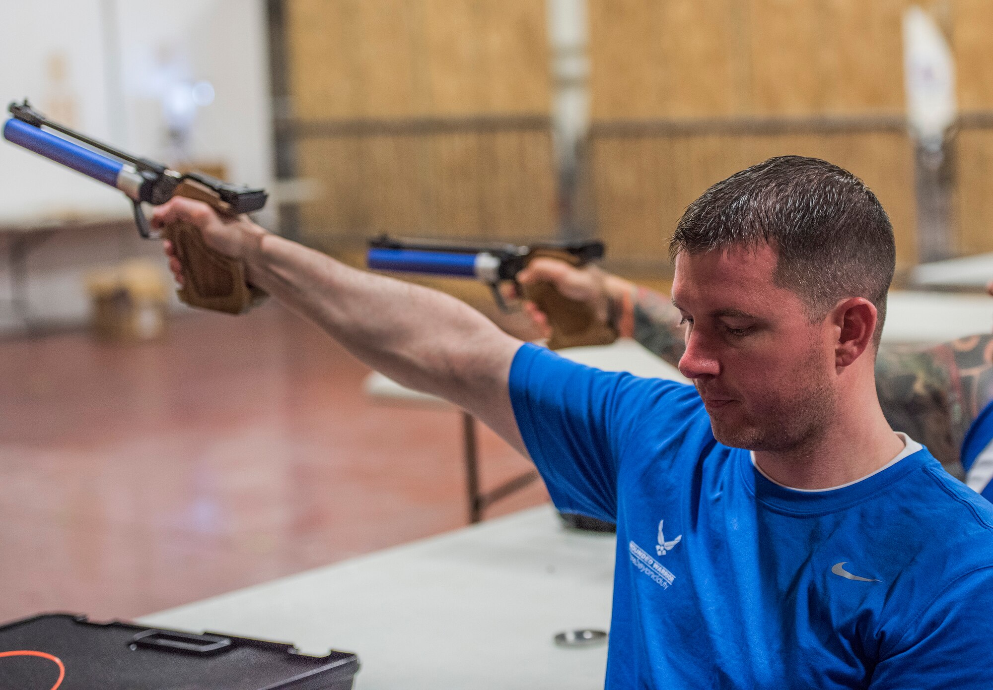 A Warrior CARE athlete, Corey Stanley aims his air pistol during a shooting session at the adaptive sports camp at Eglin Air Force Base, Fla., April 26. The base hosts the week-long Wounded Warrior CARE event that helps recovering wounded, ill and injured military members through specific hand-on rehabilitative training. (U.S. Air Force photo/Ilka Cole)