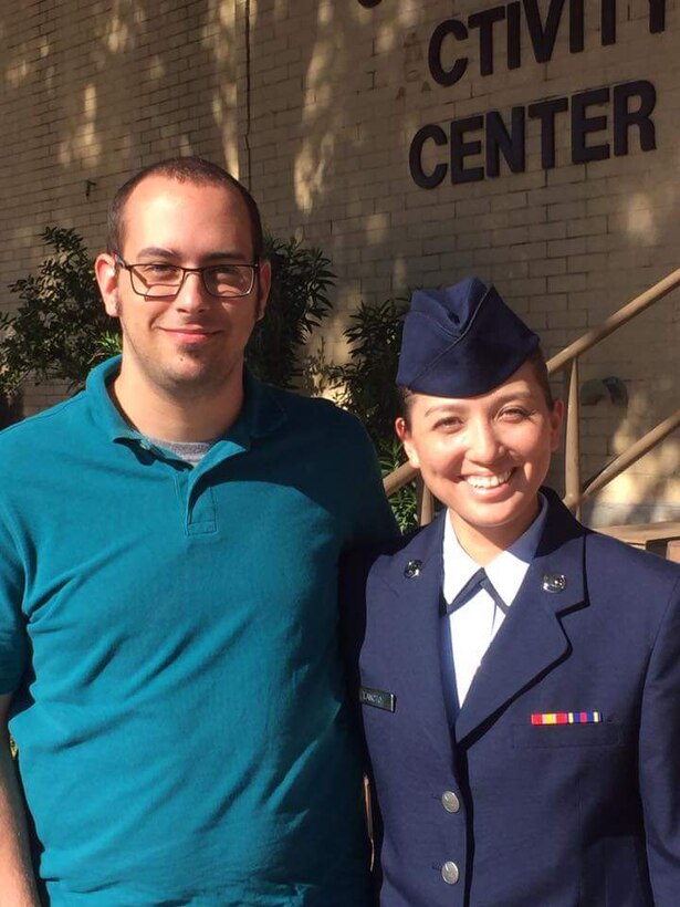 U.S. Air Force Airman 1st Class April Lancto, 7th Bomb Wing Public Affairs photojournalist, smiles in a photo with her fiancé, Taylore, during her Basic Military Training graduation at Lackland Air Force Base, Texas, Jan. 15, 2016. Lancto joined the Air Force because she wanted to continue a family tradition of military service. (Courtesy photo)