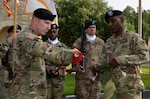 Col. Dennis McGowan (left) and Command Sgt. Maj. Jerry Charles (right) case the 412th Contracting Support Brigade organizational colors during the unit's inactivation ceremony April 26 at Joint Base San Antonio-Fort Sam Houston, Texas. The inactivation of the brigade is a result of force structure changes directed by the secretary of the Army to adapt the service's force generation process to the needs of a contingency force. McGowan served as commander of the 412th CSB since September 2015 and Charles has served the brigade command sergeant major. 