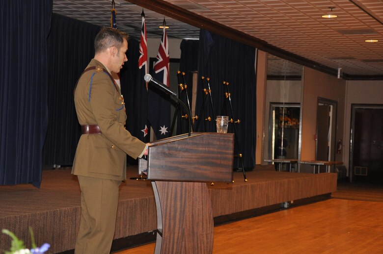 PETERSON AIR FORCE BASE, Colo. – Australian Army Lt. Col. Simon McDonald, U.S. Army Space and Missile Defense Command/Army Forces Strategic Command satellite communications operations officer, describes the 1915 campaign at Gallipoli, Turkey, during an Australian and New Zealand Army Corps Day Dawn Service at The Club, April 25, at Peterson Air Force Base, Colo. Marking the 101st ANZAC Day, approximately 75 U.S. and Australian service members commemorated not only the ANZAC entrance into World War I as an independent nation but also to remember all those who have given the ultimate sacrifice in all conflicts. (U.S. Army photo by Scott Andreae)