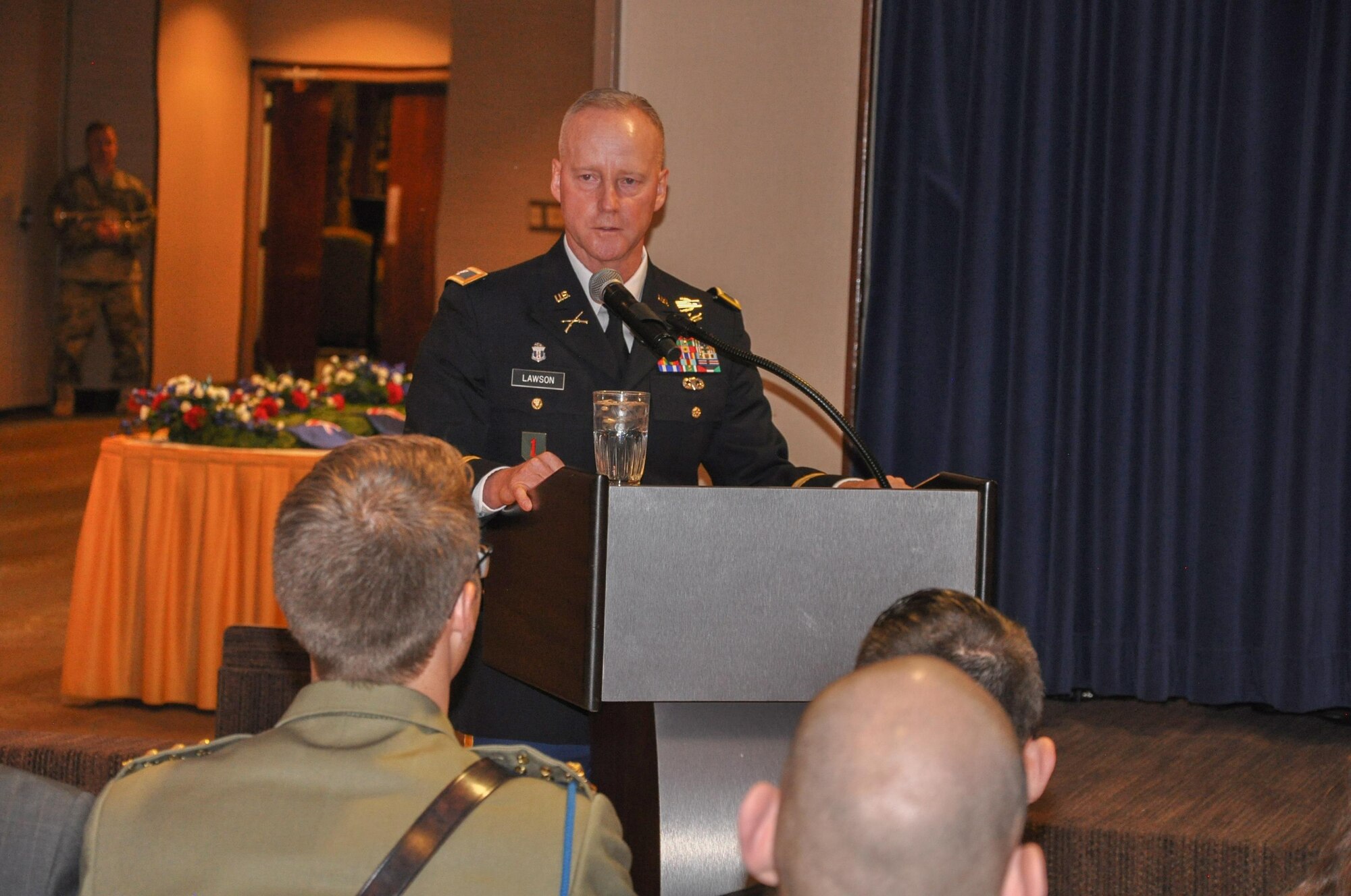 PETERSON AIR FORCE BASE, Colo. – U.S. Army Col. Tim Lawson, U.S. Army Space and Missile Defense Command/Army Forces Strategic Command support deputy commander, addresses the audience during an Australian and New Zealand Army Corps Day Dawn Service at The Club, April 25, at Peterson Air Force Base, Colo. Marking the 101st ANZAC Day, approximately 75 U.S. and Australian service members commemorated not only the ANZAC entrance into World War I as an independent nation but also to remember all those who have given the ultimate sacrifice in all conflicts. (U.S. Army photo by Scott Andreae)