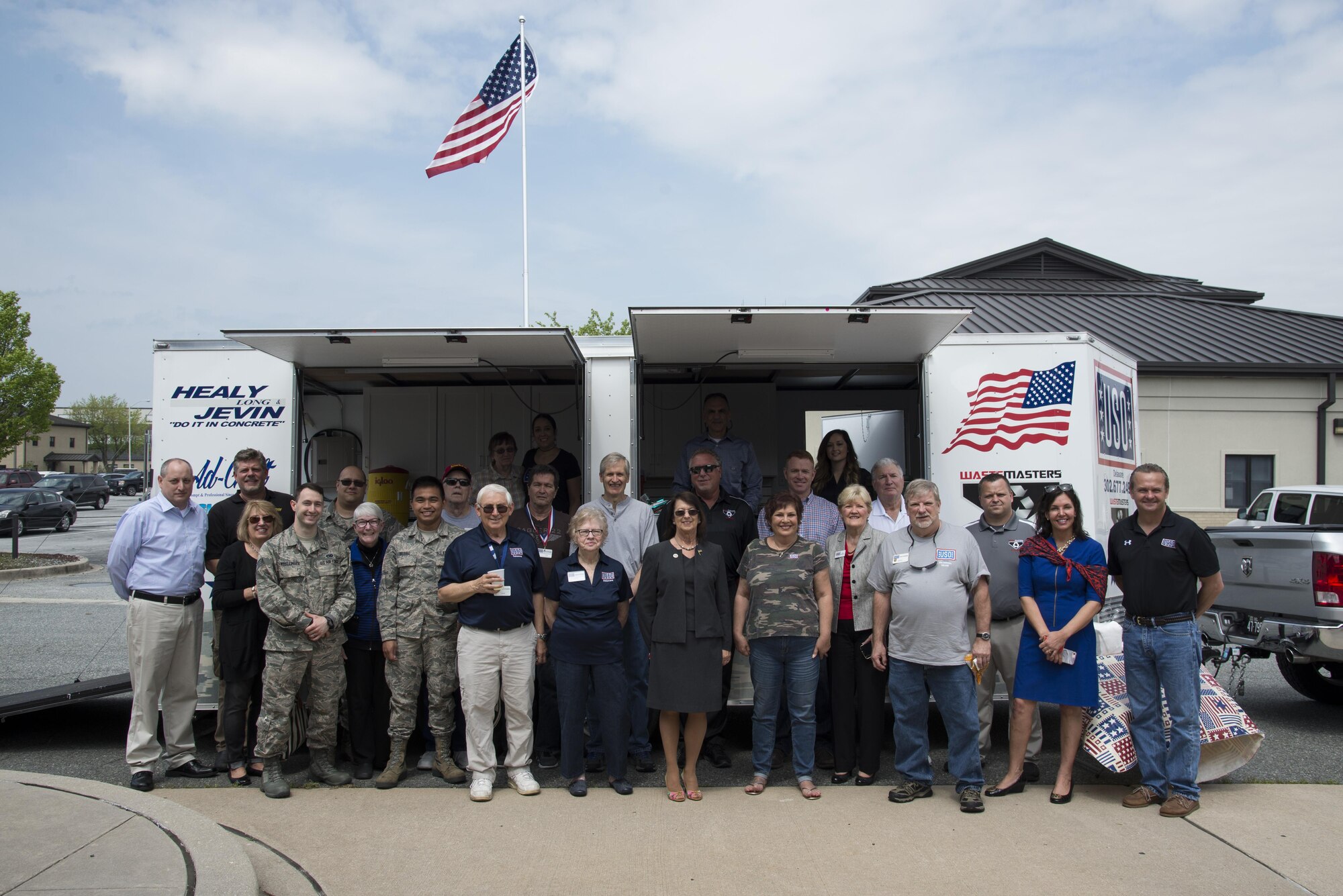USO Delaware volunteers stand in front of a new food trailer during its dedication ceremony April 27, 2017, at the USO headquarters on Dover Air Force Base, Del. Volunteers distributed free food to USO guests during the food trailer’s inauguration. (U.S. Air Force photo by Senior Airman Aaron J. Jenne)