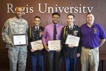 U.S. Army Chief Warrant Officer 2 Robert Heflin, left, Colorado Army National Guard telecommunications manager, and Junior Reserve Officer Training Corps students and managers from Denver North High School display their certificates of appreciation from the U.S. Air Force Association 2017 CyberPatriot, National Youth Cyber Defense competition.