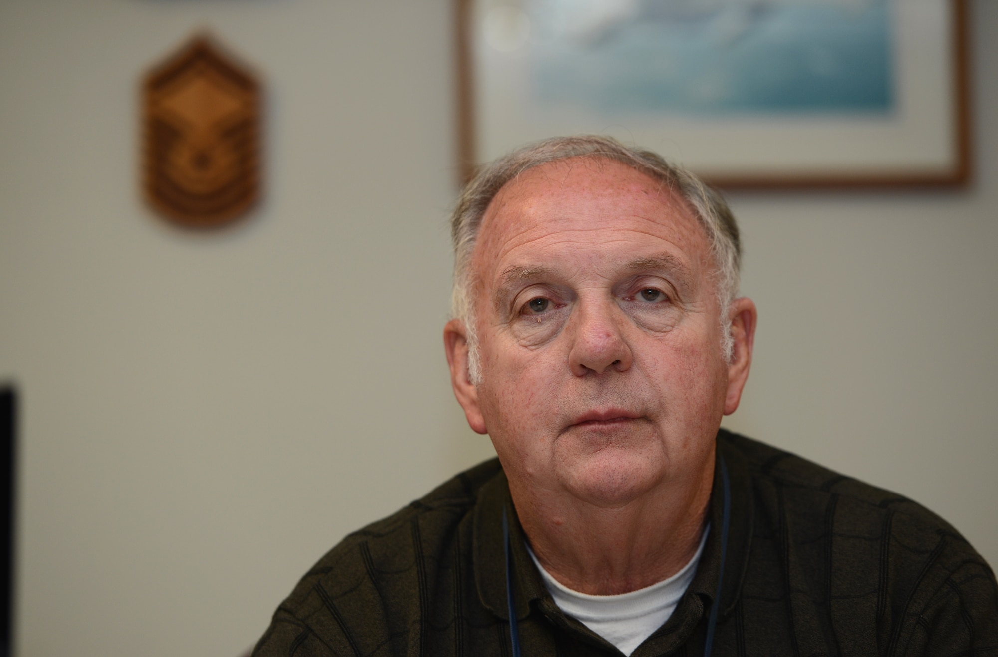 Carl Barnes, 62nd Maintenance Squadron munitions flight chief, poses for a photo at the munitions area on McChord Field, Wash., April 24, 2017. After more than 50 years of dedicated active duty and civil service employment in the munitions career field, Barnes is retiring and looks forward to what lies ahead. (U.S. Air Force photo/Senior Airman Jacob Jimenez)