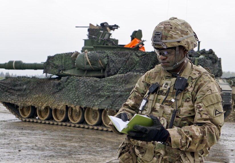 Army Sgt. 1st Class Ndifrek Aanam-Ndu injects a mock casualty into the battle scenario to assess how a team handles the casualty using its combat lifesaving, tactical field care and casualty evacuation training during Exercise Combined Resolve 8 in Grafenwoehr, Germany, 8, April 22, 2017. Army photo by Sgt. Karen Sampson