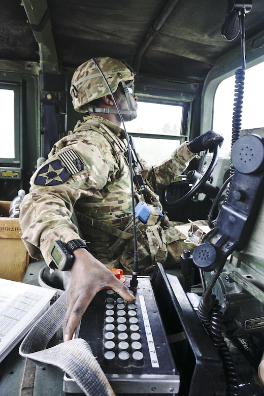 Army Sgt. 1st Class Ndifrek Aanam-Ndu presses a button on an artillery fire simulator during Exercise Combined Resolve 8 in Grafenwoehr, Germany, April 21, 2017. Army photo by Sgt. Karen Sampson