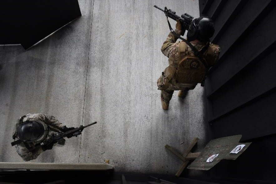 Members of the explosive ordnance disposal flight participated in a shoot, move and communicate challenge during Police week, April 20, 2017, at Seymour Johnson Air Force Base, North Carolina. The competition consisted of a team challenge in which they had to rescue hostages in a timely manner. (U.S. Air Force photo by Airman 1st Class Miranda A. Loera)