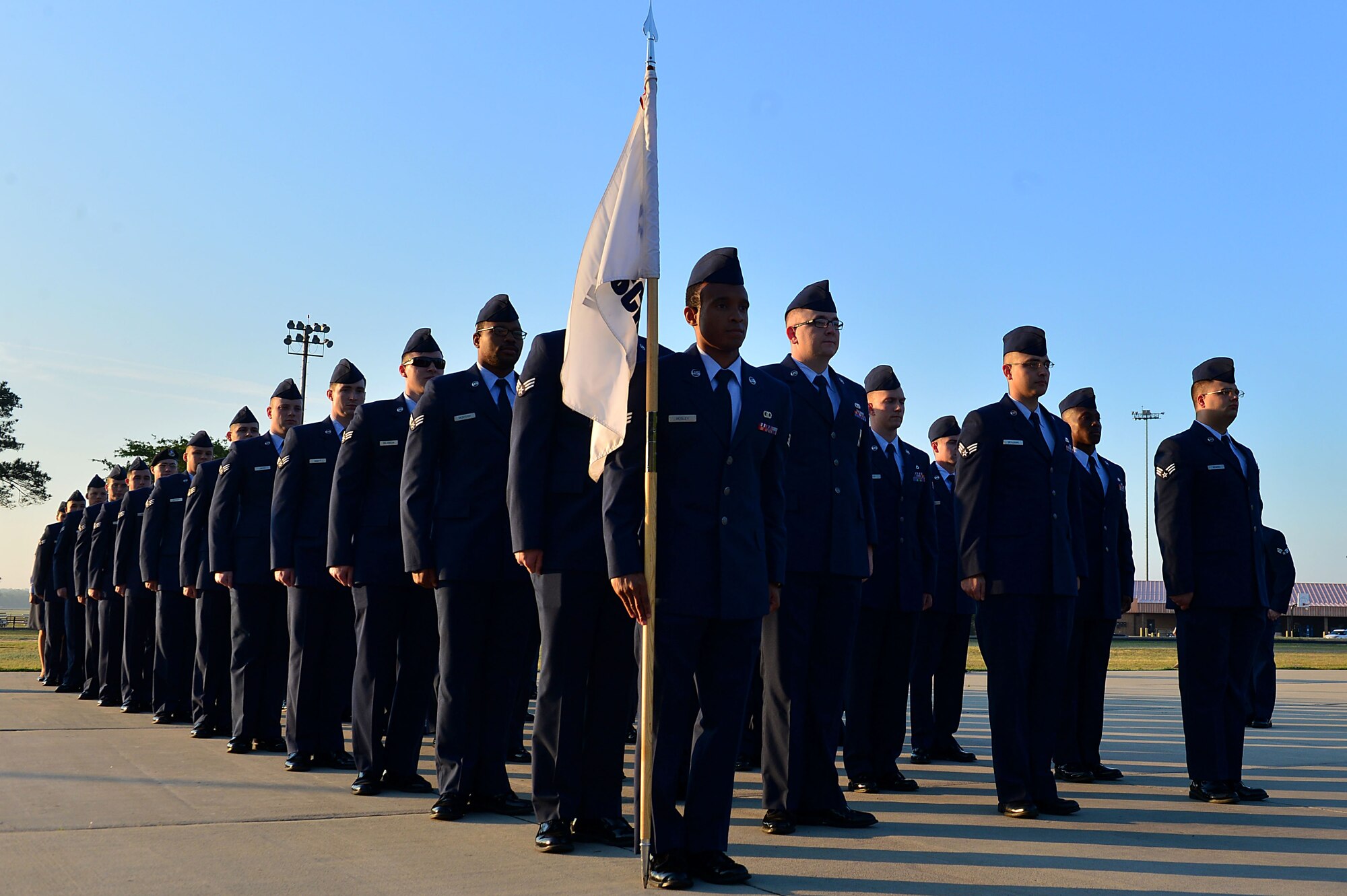 U.S. Airmen assigned to the Senior Master Sgt. David B. Reid Airman Leadership School Class 17-4, stand at attention during a uniform inspection at Shaw Air Force Base, S.C., April 27, 2017. Airmen attending the five-week ALS course receive three uniform inspections to ensure they are in compliance with Air Force Instruction 36-2903 Dress and Personal Appearance of Air Force Personnel at all times. (U.S. Air Force photo by Airman 1st Class Christopher Maldonado)