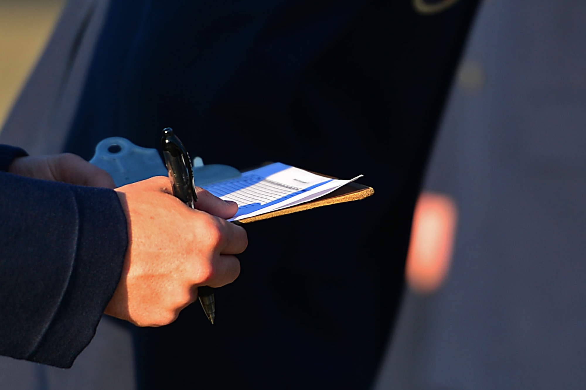 An Airman assigned to the Senior Master Sgt. David B. Reid Airman Leadership School (ALS), writes-down discrepancies during a uniform inspection at Shaw Air Force Base, S.C., April 27, 2017. The uniform inspection gave instructors the opportunity to inspect the serviceability of ALS Airmen’s service dress uniforms as well as their military bearing. (U.S. Air Force photo by Airman 1st Class Christopher Maldonado)