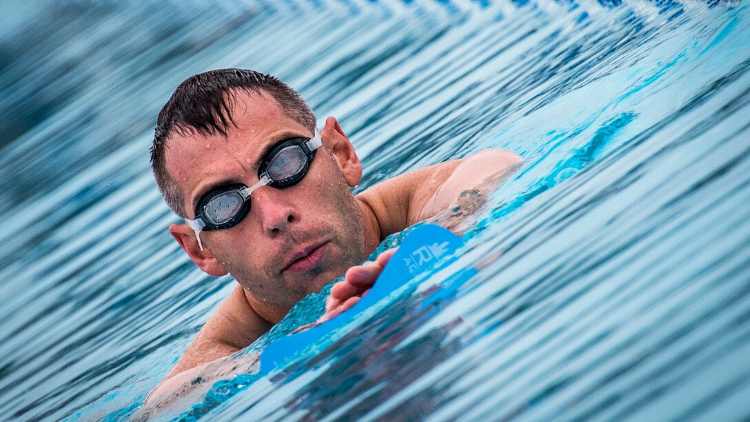 B.J. Lange, an athlete participating in a Wounded Warrior event, moves toward the edge of the pool in the swimming session of the adaptive sports camp at Eglin Air Force Base, Fla., April 27, 2017. The base hosted the event, which helps recovering wounded, ill and injured military members through specific hands-on rehabilitative training. Air Force photo by Samuel King Jr.