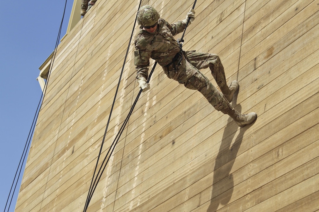 1st Lt. Alex Kalsic, the aerial delivery officer with the 316th Sustainment Command (Expeditionary), 1st Sustainment Command (Theater), rappels from a tower during a Rappel Master Course at Camp Buehring, Kuwait, April 19, 2017. (U.S. Army photo by Sgt. 1st Class Al Gagow)