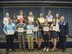Military students from the local area pose for a group photo after being awarded their scholarship certificates during the OSC scholarship reception in the Red Morgan Center at Fairchild Air Force Base, Washington, April 27, 2017. The scholarship money came from earnings donated by the Fairchild Thrift Store whose volunteers put in more than 3,200 hours of their free time. (U.S. Air Force photo/Tech. Sgt. Travis Edwards)