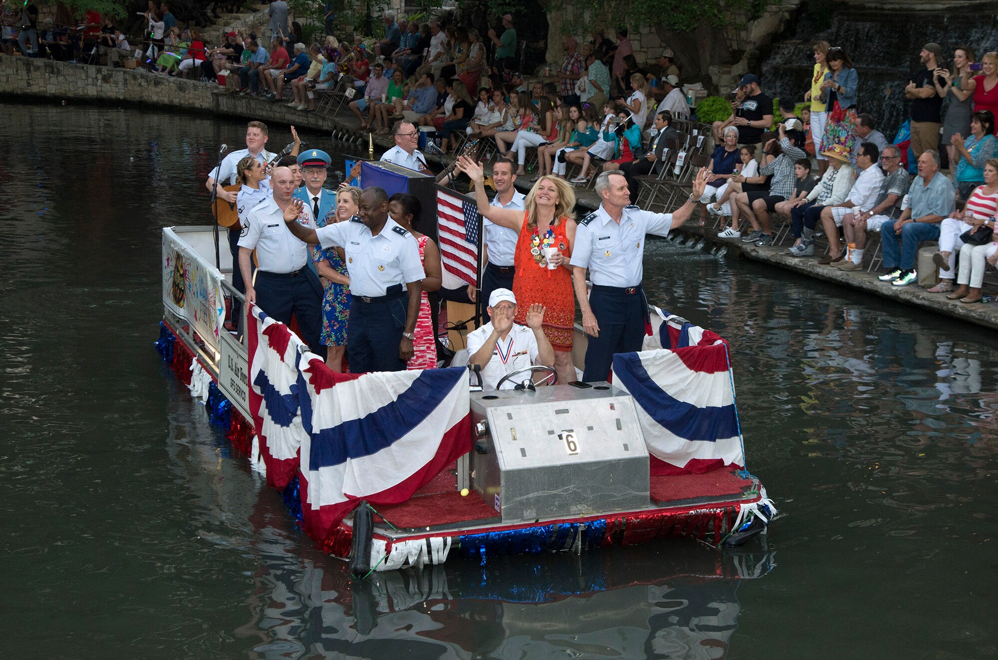 U.S. Air Force Lt. Gen. Darryl Roberson, commander Air Education and Training command, and Maj. Gen. Mark Brown, AETC vice commander ride on a boat during the 2017 Fiesta River Parade April 24, 2017 at  the Riverwalk in San Antonio, T.X. This year marks the 126th anniversary of the colorful Fiesta festivity, honoring traditions deeply rooted throughout the area and celebrating the historic partnerships between the Airmen of Joint Base San Antonio and the local community. (U.S. Air Force photo by Johnny Saldivar)