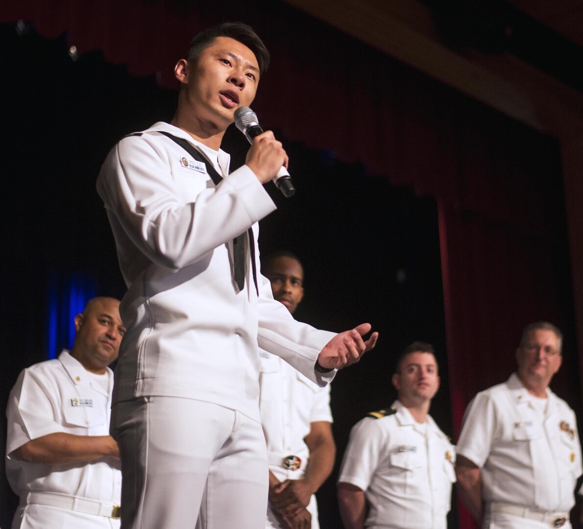 Petty Officer 3rd Class Sijia Liu, assigned to the amphibious transport dock ship USS San Antonio (LPD 17), speaks to students at Winston Churchill High School in San Antonio. Seven Sailors from the San Antonio, including the executive officer and the command master chief, are visiting their ship's namesake during Fiesta San Antonio.