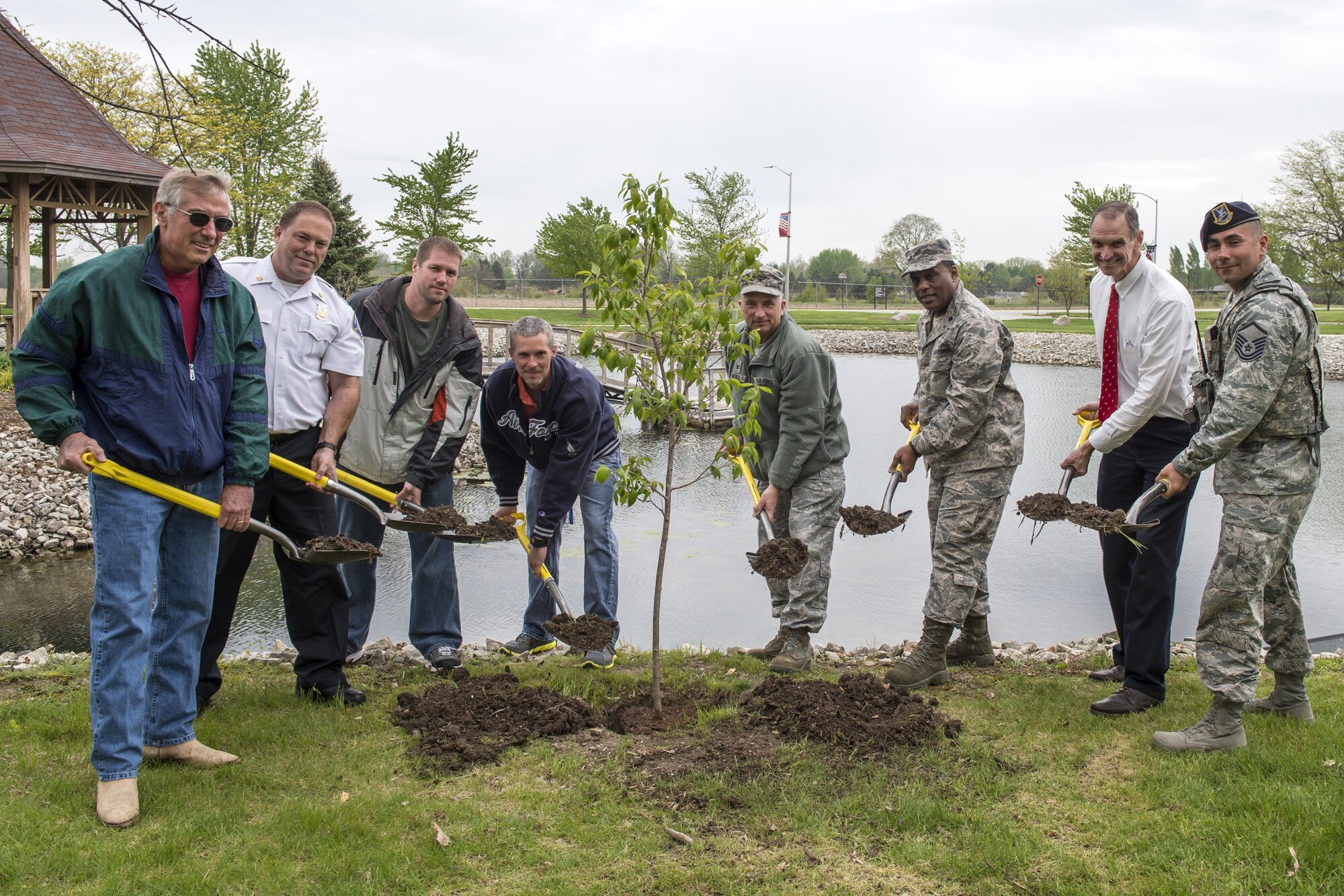 Grissom Airmen and civilians pose for a photo during a special Arbor Day ceremony held here April 28, 2017. From left to right are: Phil Shott, 434th Maintenance Group civilian executive officer; John Ireland, Grissom fire chief; Kevin Mortier, 434th Mission Support Group environmental protection specialist; Cory Walters, 434th Civil Engineer Squadron biological scientist; Col. Scott Russell, 434th MSG commander; Lt. Col. Obadiah Smith, 434th Air Refueling Wing chaplain; Marty Foye, 434th ARW financial services officer and Master Sgt. Timothy Holmgren, 434th Security Forces shift supervisor. (U.S. Air Force photo/Tech. Sgt. Benjamin Mota)