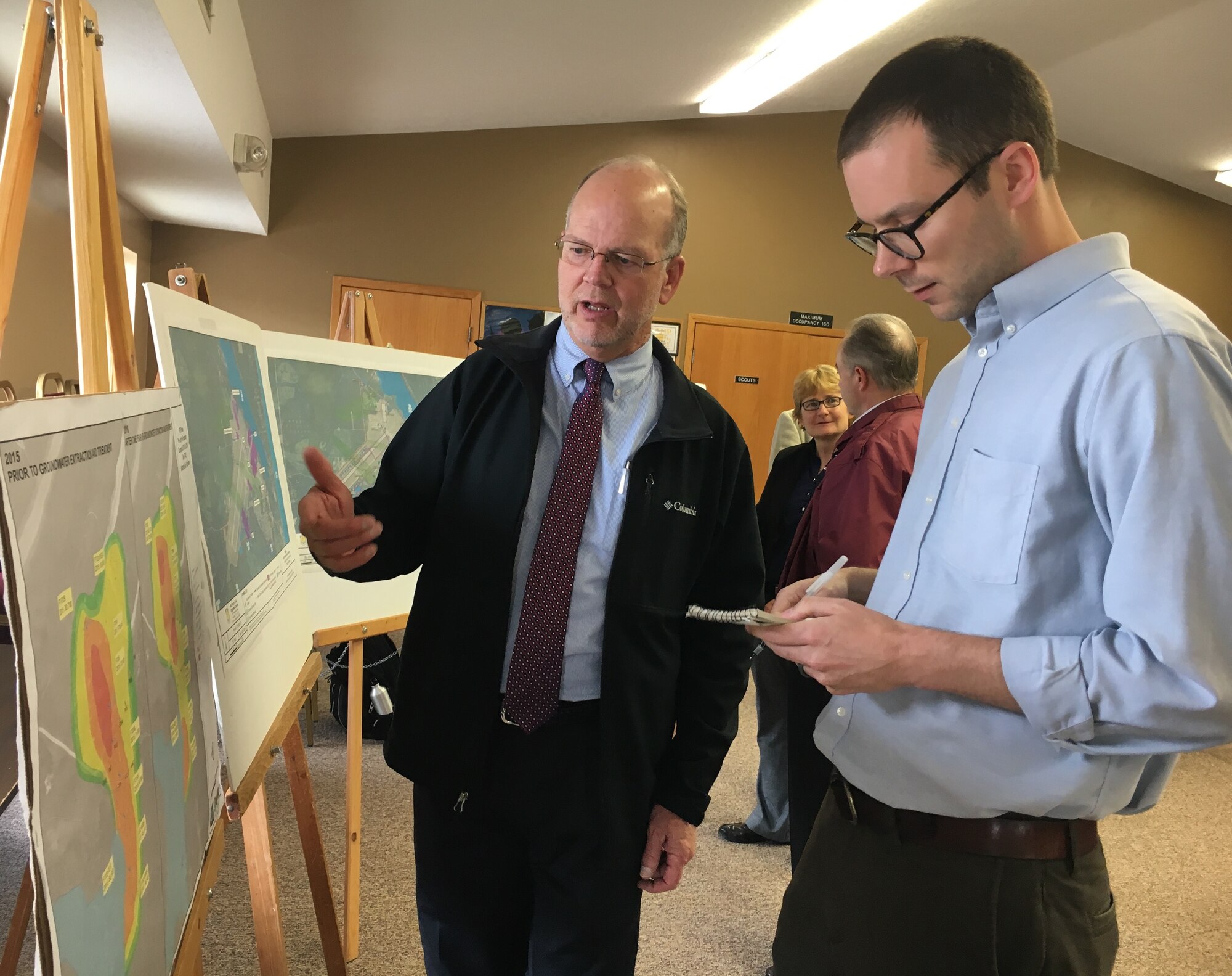 Paul Carroll, Base Environmental Coordinator with the Air Force Civil Engineer Center, updated members of the Au Sable and Oscoda communities on the Air Force’s aggressive measures to reduce the risk of drinking water impacts caused by past mission activities at the former Wurtsmith Air Force Base, Michigan, during an open house April 25, in Oscoda. (Photo by Angelina Casarez/ Air Force Photo Released)