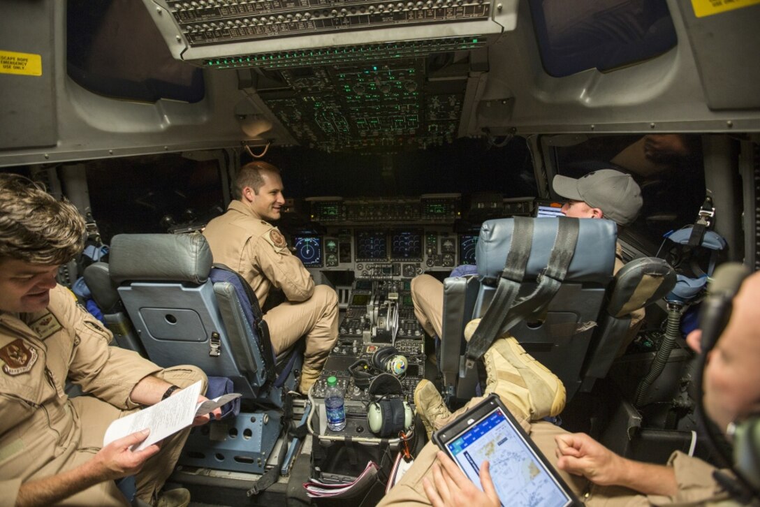 MARINE CORPS AIR STATION CHERRY POINT, N.C. – U.S. Air Force Maj. Robert Riggs, U.S. Marine Corps Forces, Special Operations Command air mobility liaison officer (AMLO), prepares for his mission on the flight deck of a C-17 aircraft at MCAS Cherry Point. As MARSOC’s AMLO, Riggs provides a critical link of communication between the airlift and ground forces in the area of operations. He facilitates the timely flow of critical information between the air mobility network and MARSOC units into sensitive, forward-deployed environments around the globe. (U.S. Marine Corps photo by Sgt. Salvador Moreno, released) 