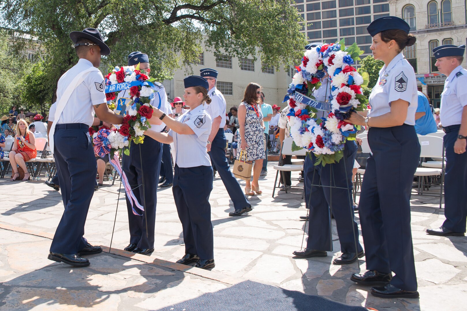 Airmen from Joint Base San Antonio place memorial wreaths during the 2017 Pilgrimage to the Alamo as part of Fiesta San Antonio April 24, 2017. The Pilgrimage to the Alamo includes a march through downtown San Antonio and ends with a wreath laying ceremony in honor of those who fought in the Battles of the Alamo and San Jacinto. Servicemembers from around JBSA participate in Fiesta San Antonio activities representing the progression of the United States military. (U.S. Air Force photo by Andrew Patterson)