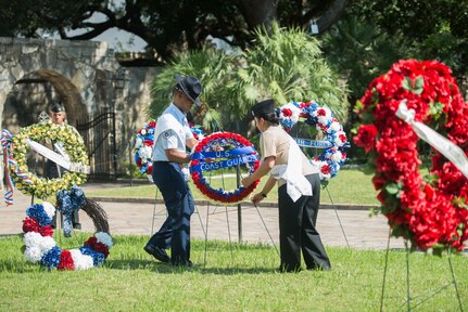 Airmen from Joint Base San Antonio place memorial wreaths during the 2017 Pilgrimage to the Alamo as part of Fiesta San Antonio April 24, 2017. The Pilgrimage to the Alamo includes a march through downtown San Antonio and ends with a wreath laying ceremony in honor of those who fought in the Battles of the Alamo and San Jacinto. Servicemembers from around JBSA participate in Fiesta San Antonio activities representing the progression of the United States military. (U.S. Air Force photo by Andrew Patterson)