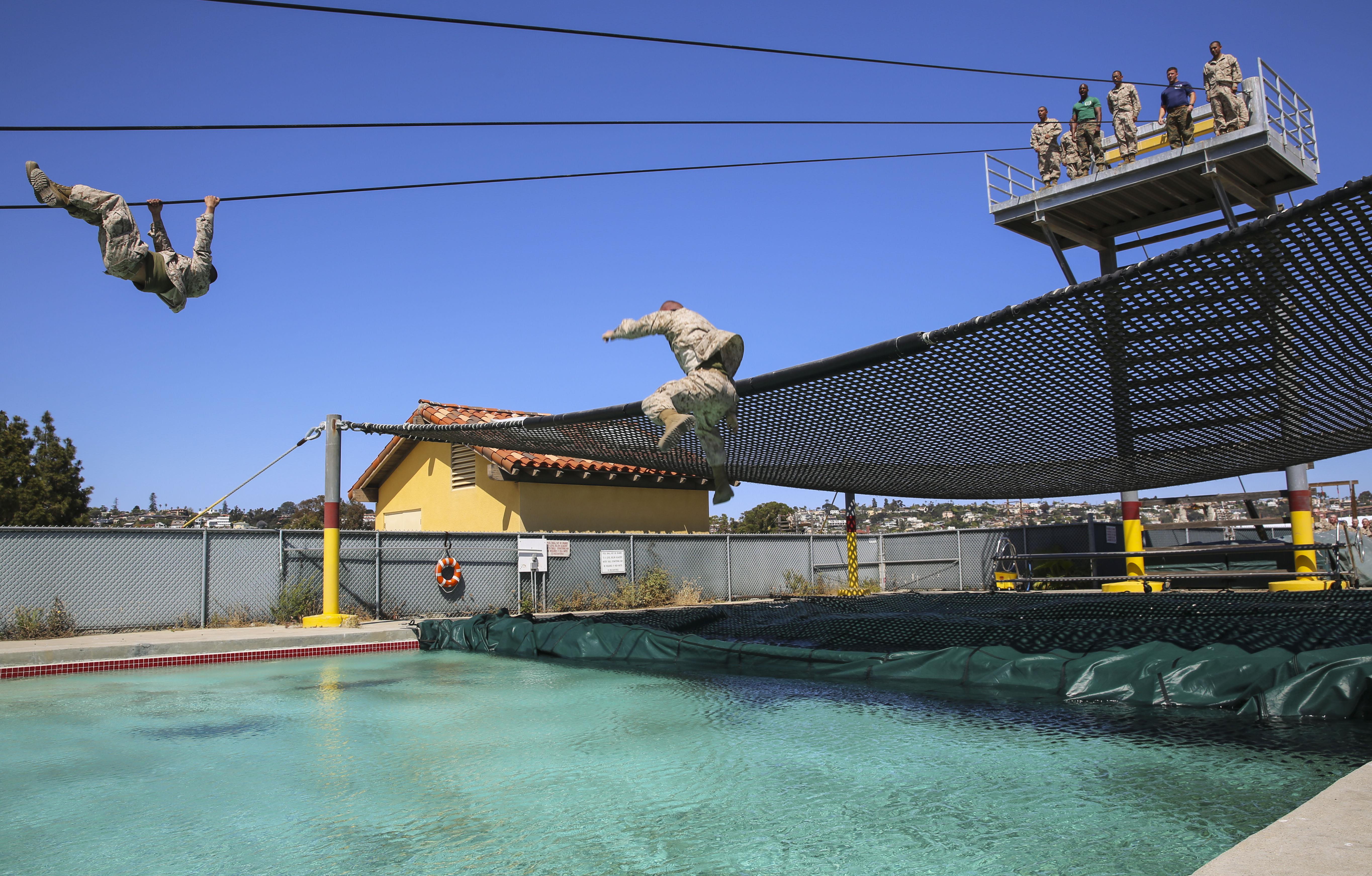 Recruits from India Company, 3rd Recruit Training Battalion, participate in the Slide for Life obstacle during Confidence Course II at Marine Corps Recruit Depot San Diego, April 18. As the last obstacle, recruits needed to summon every ounce of confidence and strength if they wanted to leave the event dry. Annually, more than 17,000 males recruited from the Western Recruiting Region are trained at MCRD San Diego. India Company is scheduled to graduate June 16.