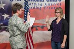 Alayna Stevenson recites the oath of enlistment, April 4, 2017,in Cheyenne, Wyoming. Alayna's enlistment is a result of a home school event sponsored by the 153rd Recruiting and Retention office. 