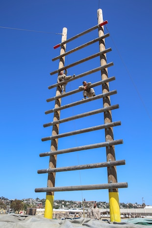 Recruits from India Company, 3rd Recruit Training Battalion, climb a high obstacle during Confidence Course II at Marine Corps Recruit Depot San Diego, April 18. Obstacles in the course included the Monkey Bridge, Skyscraper Wall Climb and several others. Annually, more than 17,000 males recruited from the Western Recruiting Region are trained at MCRD San Diego. India Company is scheduled to graduate June 16.