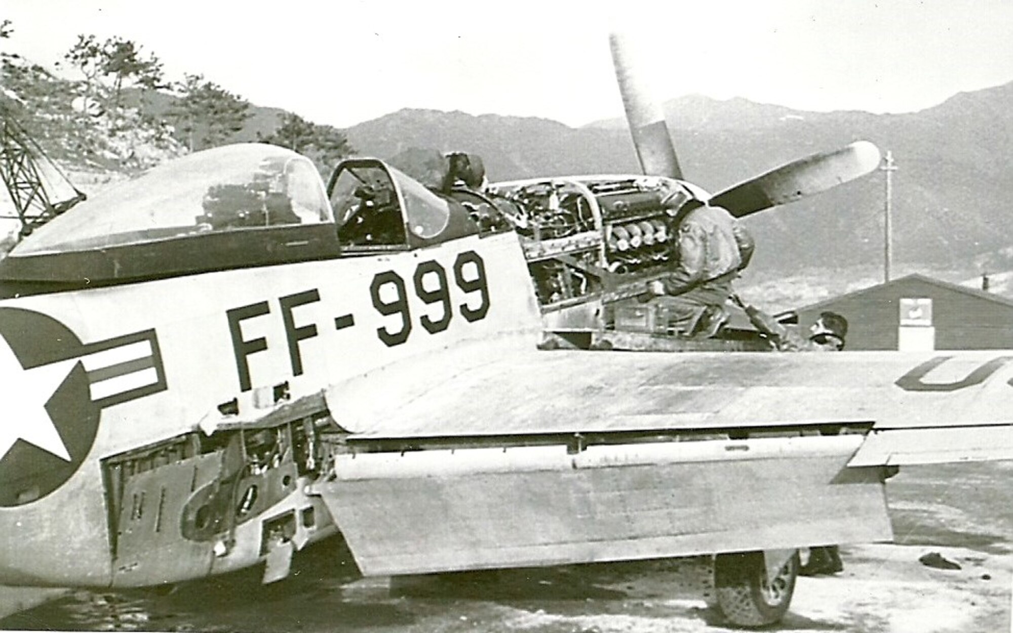 “Ernie’s” Mustang, FF-999, undergoes a 100 hour inspection by a maintenance team, K-46 Air Base, Korea, 1951.