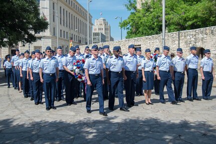 Leaders of Air Education and Training Command and Joint Base San Antonio carry wreaths and lead the processional April 24, 2017 during the annual Pilgrimage to the Alamo as part of Fiesta. The wreath-bearing procession is a solemn occasion during which historic, civic, patriotic, military and school groups depart Municipal Auditorium and walk silently to the Alamo. 