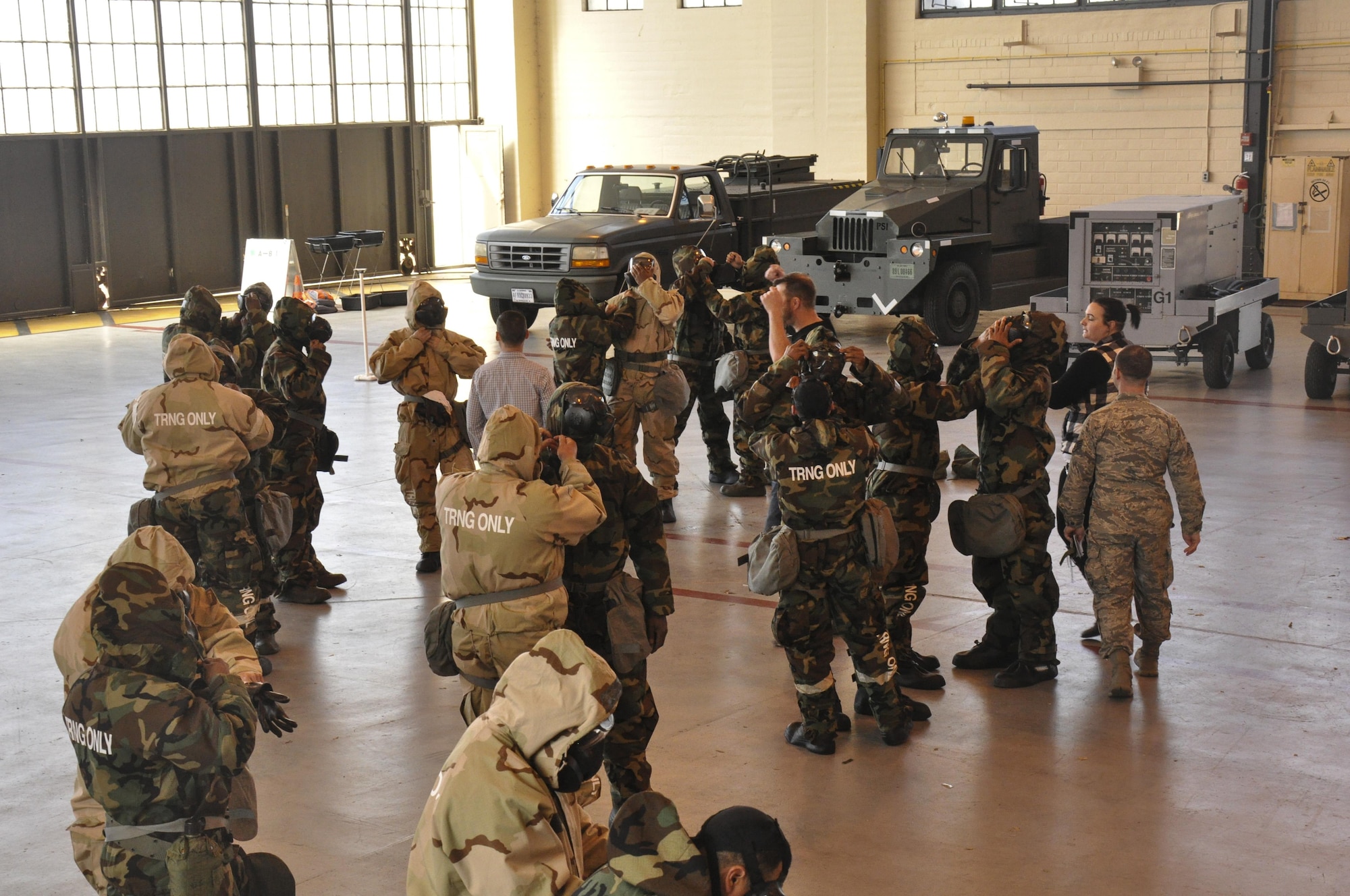 Members of the 908th Airlift Wing run-through donning level 4 mission-oriented protective posture gear during the Basic Deployment Readiness Rodeo March 4, at Maxwell Air Force Base, Ala. The BDR Rodeo was a three day readiness training where Air Force personnel practiced a number of predeployment activities to include Chemical, Biological, Radioactive, and Nuclear preparedness training. (U.S. Air Force photo by Staff Sgt. Malia Belton)