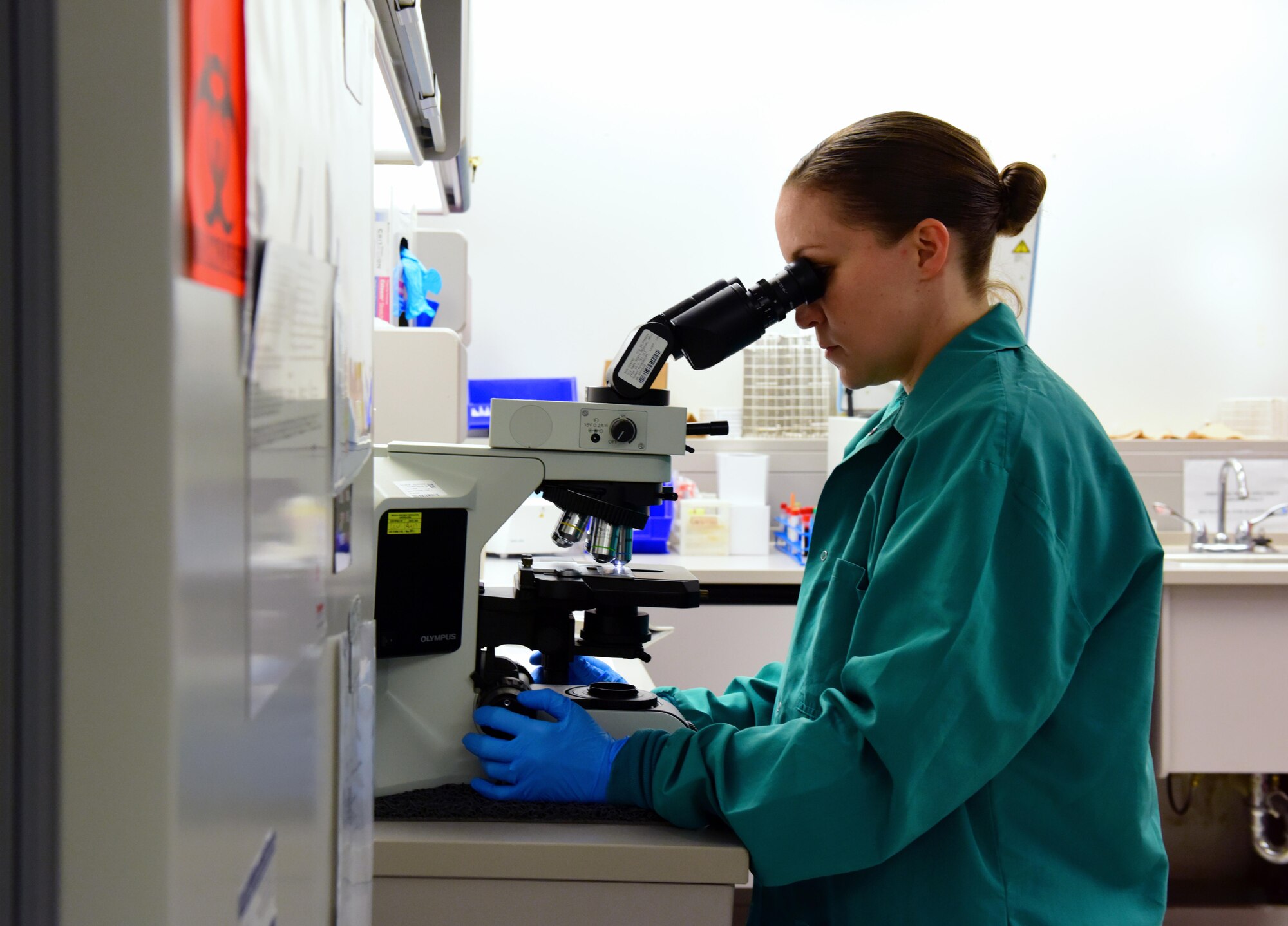 U.S. Air Force Master Sgt. Laura Bass, the 509th Medical Support Squadron diagnostics and therapeutic flight chief, checks a sample for bacteria and parasites at Whiteman Air Force Base, Mo., April 21, 2017. If bacteria is identified, testing can be performed to determine which antibiotics the patient can use to treat the infection. (U.S. Air Force photo by Airman 1st Class Jazmin Smith)