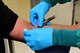 U.S. Air Force Staff Sgt. Jon Ringenoldus, a laboratory technician assigned to the 509th Medical Support Squadron, collects a blood sample from a patient at Whiteman Air Force Base, Mo., April 21, 2017. Much of the work goes on behind the scenes where technicians test and analyze specimens. Together, the lab performs more than 100,000 tests a year. (U.S. Air Force photo by Airman 1st Class Jazmin Smith)