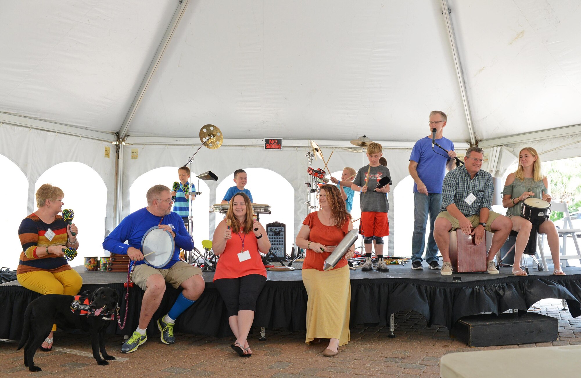 Warrior C.A.R.E. summit attendees play musical instruments together at Portofino Island Resort, Pensacola Beach, FL, April 27, 2017. The summit was filled with activities for both adults and children designed to improve resiliency and strengthen relationships. (U.S. Air Force photo/Staff Sgt. Melanie Holochwost)