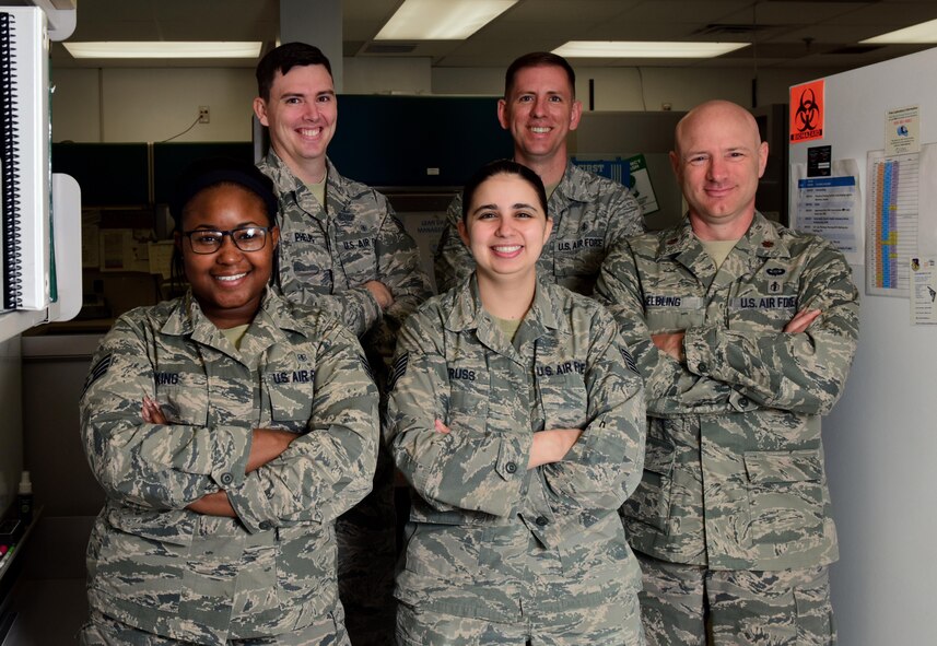 Airmen assigned to the 509th Medical Support Squadron stop for a photo during “Medical Laboratory Professionals Week” at Whiteman Air Force Base, Mo., April 24, 2017. The shop’s team is divided into five sections: chemistry, hematology, microbiology, serology and urinalysis. (U.S. Air Force photo by Airman 1st Class Jazmin Smith)