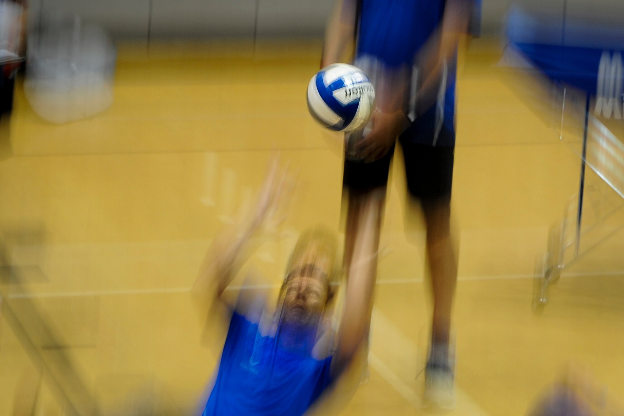 Keary Gwinn, a member of the Air Force sitting volleyball team, sets the volleyball during a scrimmage at Hurlburt Field, Fla., April 24, 2017. The scrimmage was part of training before their annual competition in June. (U.S. Air Force photo by Airman 1st Class Dennis Spain)