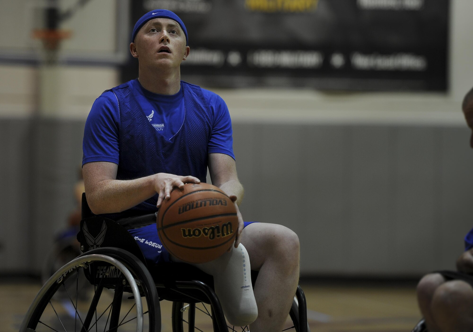 Austin Williamson, a shooting guard with the Air Force wheelchair basketball team, prepares to shoot a free throw during practice at Hurlburt Field, Fla., April 24, 2017. The team is composed of wounded warriors who compete against other Department of Defense teams. (U.S. Air Force photo by Airman 1st Class Dennis Spain)