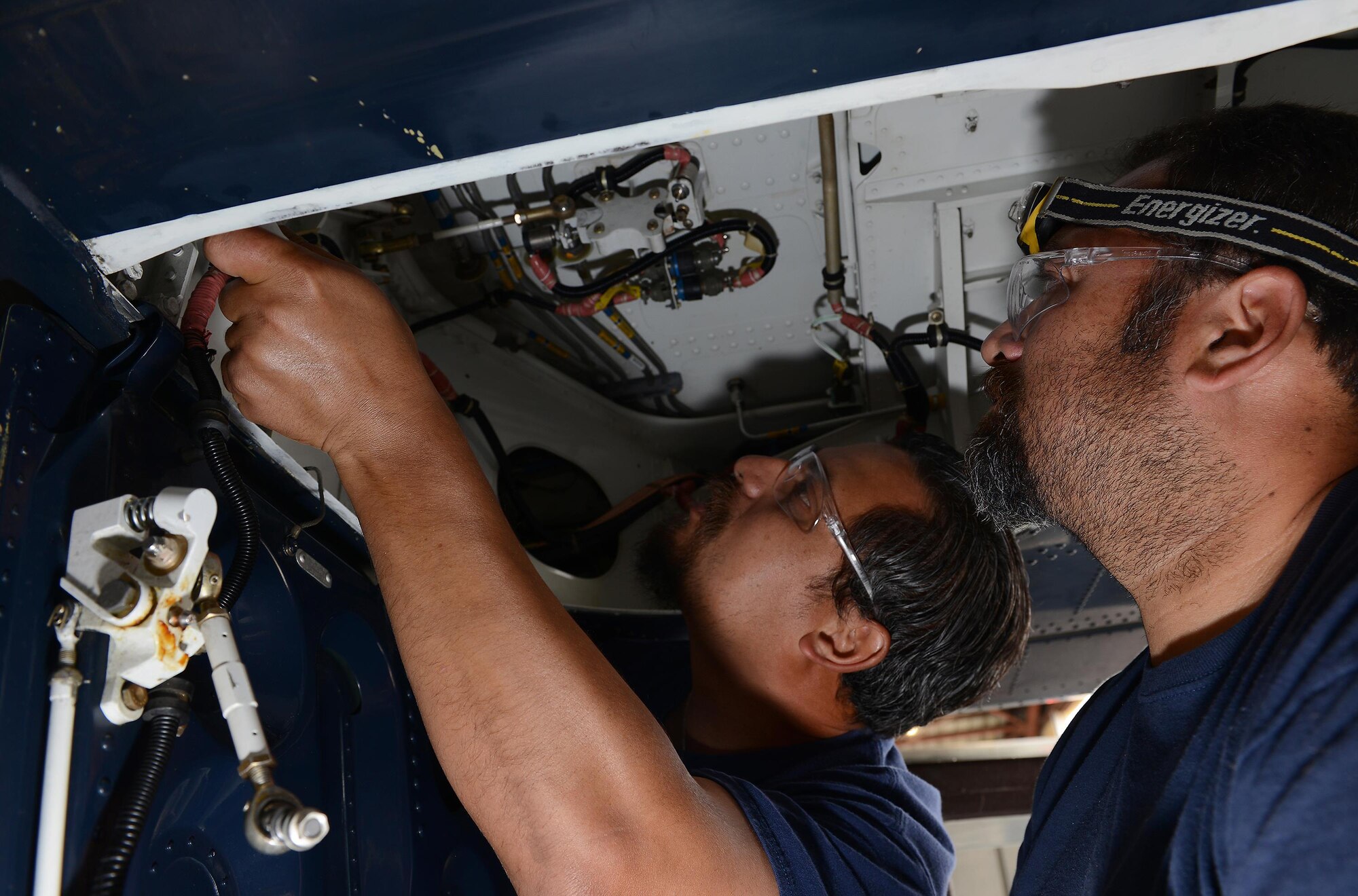 Leo Gonzalez (left) and Armando Patiño (right), 47th Maintenance Directorate maintainers, inspect the landing gear of a T-6 Texan II on Laughlin Air Force Base, Texas, April 12, 2017. Laughlin has the lowest amount of T-6 hangar queens in Air Education and Training Command. A “hangar queen” is an aircraft that hasn’t been flown in more than 30 days. (U.S. Air Force photo/Airman 1st Class Benjamin N. Valmoja)